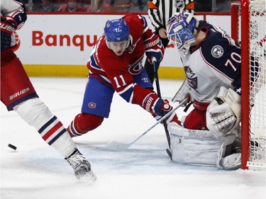 Columbus Blue Jackets goalie Joonas Korpisalo, right, stops a shot by Montreal Canadiens right wing Brendan Gallagher during NHL action at the Bell Centre in Montreal on Tuesday January 26, 2016.
