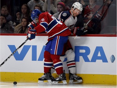 Columbus Blue Jackets left wing Scott Hartnell, right, grimaces as he is hit by Montreal Canadiens defenceman P.K. Subban during NHL action at the Bell Centre in Montreal on Tuesday January 26, 2016.