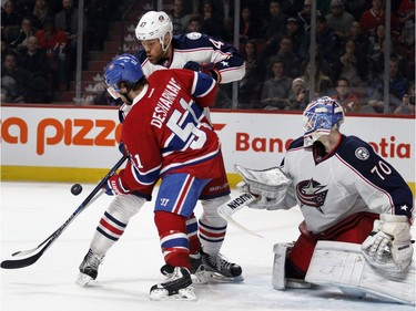 Montreal Canadiens centre David Desharnais, left, struggles with Columbus Blue Jackets defenceman Dalton Prout as Columbus Blue Jackets goalie Joonas Korpisalo follows the puck during NHL action at the Bell Centre in Montreal on Tuesday January 26, 2016.