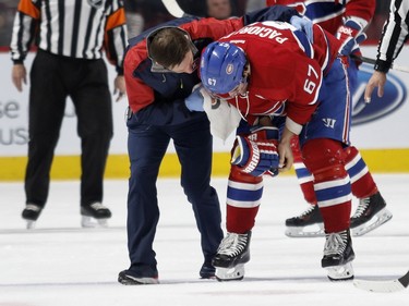 Montreal Canadiens left wing Max Pacioretty is taken off the ice after being hit in the head by a puck during NHL action against the Columbus Blue Jackets at the Bell Centre in Montreal on Tuesday Jan. 26, 2016.