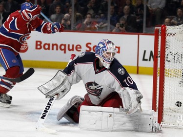Montreal Canadiens right wing Brendan Gallagher, left, celebrates as the Canadiens score their second goal against Columbus Blue Jackets goalie Joonas Korpisalo during NHL action at the Bell Centre in Montreal on Tuesday January 26, 2016.
