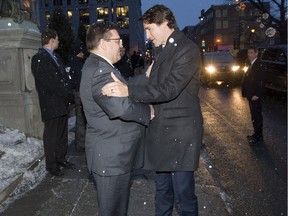 Montreal Mayor Denis coderre greets Prime Minister Justin Trudeau at city hall Jan. 26, 2016. They discussed, among other things, the mayor's opposition to the proposed Energy East pipline.