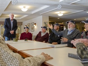 MONTREAL, QUE.: JANUARY 4, 2016 -- Kirkland city councillor John Forson, standing, with members of a Gentlemen's Club at Manoir Kirkland where he volunteers, in Kirkland, Montreal, Monday January 4, 2016.  The club has around 12 members between the ages of 75 and 94. They gather to organize fundraisers and socialize.  (Phil Carpenter / MONTREAL GAZETTE).