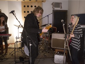 Sheenah Ko, left, Jace Lasek and Olga Goreas of the Besnard Lakes rehearse at Breakglass Studios in Montreal on Monday, January 4, 2016.