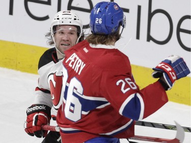 Forward Bobby Farnham of the New Jersey Devils confronts  Montreal Canadiens defenseman Jeff Petry in the first period at the Bell Centre in Montreal on Wednesday, Jan. 6, 2016.