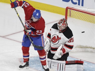 Forward Daniel Carr of the Montreal Canadiens tries to deflect the puck past Cory Schneider of the New Jersey Devils in the second period at the Bell Centre in Montreal Wednesday, January 6, 2016.