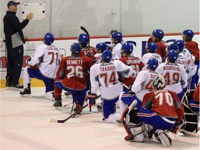 Coach Sylvain Lefebvre outlines drills for young players at the Montreal Canadiens annual development camp in Brossard in July 2013. In the NHL, there are four times as many players born in the first three months of the year compared to those born in the last three months.