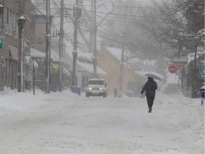 A pedestrian walks along Lakeshore Road in the Pointe-Claire Village. (Allen McInnis / THE GAZETTE file photo)