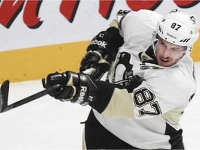 Pittsburgh Penguins star Sidney Crosby follows through on a shot during warmup before a game against the Canadiens at the Bell Centre on Nov. 18, 2014.
