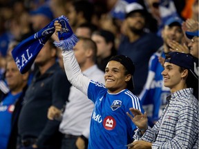 Impact fans cheer the team on during MLS game against the Chicago Fire at Saputo Stadium in Montreal on Sept. 23, 2015.