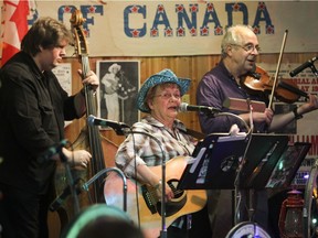"These evenings are more than just old-time country music," says Jeannie Arsenault, playing with Bill Bland, left, and Steve Comtois at the Wheel Club's Hillbilly Night in 2011. "It's about participating and socializing with people who share the same passion."