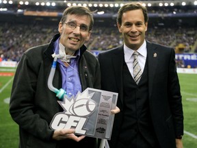 Canadian Football League commissioner Mark Cohon (right) presents the Hugh Campbell Distinguished Leadershiop Award to former Montreal Alouette Tony Proudfoot prior to the Eastern Final between the Montreal Alouettes and Toronto Argonauts in Montreal, November 21, 2010.   Proudfoot died from ALS five years ago.