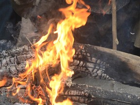 A bonfire at a roadside.