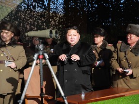 This undated picture released from North Korea's official Korean Central News Agency on Jan. 5, 2015, shows North Korean leader Kim Jong-Un (centre) inspecting a firing contest of Korean People's Army artillery units at an undisclosed location in North Korea.