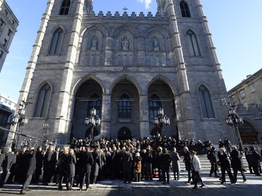 People gather at Notre-Dame Basilica in Montreal, on Friday, Jan. 22, 2016, for the funeral for Rene Angelil, late husband of Celine Dion, who died on Jan. 14, at the age of 73. (Paul Chiasson/The Canadian Press via AP)