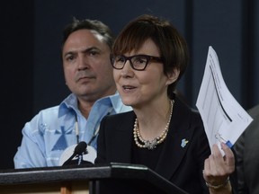 Assembly of First Nations National Chief Perry Bellegarde looks on as First Nations Child and Family Caring Society Caring Society Executive Director Cindy Blackstock speaks about the Canadian Human Rights Tribunal decision regarding discrimination against First Nations children in care, during a news conference in Ottawa, Tuesday January 26, 2016.