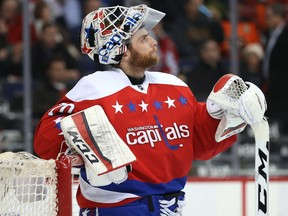 Braden Holtby of the Washington Capitals looks on after allowing a goal to the Philadelphia Flyers during the first period at Verizon Center on January 27, 2016 in Washington, DC.