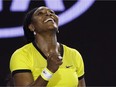 Serena Williams of the United States celebrates after defeating Agnieszka Radwanska of Poland in their semifinal match at the Australian Open tennis championships in Melbourne, Australia, Thursday, Jan. 28, 2016.