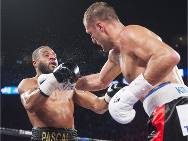 Sergey Kovalev, right, from Russia, lands a right to the head of Jean Pascal, from Laval, in their light- heavyweight world championship fight Saturday, January 30, 2016 at the Bell Centre.