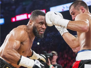 Sergey Kovalev, right, from Russia, lands a left to the head of Jean Pascal, from Laval, in their light- heavyweight world championship fight Saturday, January 30, 2016 at the Bell Centre.