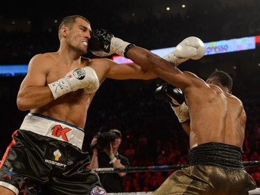 Jean Pascal of Laval (right) lands a punch on Sergey Kovalev of Russia during the WBO, WBA, and IBF light- heavyweight world championship match at the Bell Centre on January 30, 2016.
