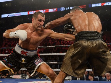 Sergey Kovalev of Russia punches Jean Pascal of Laval during the WBO, WBA, and IBF light-heavyweight world championship match at the Bell Centre on January 30, 2016.