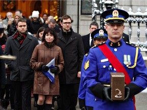 Johanne Mongeau follows the casket of her husband, former Quebec City mayor Jean-Paul L'Allier, as she leaves church following funeral services in the Quebec City Saturday, Jan. 9, 2016.
