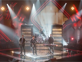 The coachs' band performing on the first show of the fourth season of La Voix on Jan. 17, 2016. (Left to right): Marc Dupré, Éric Lapointe, Ariane Moffatt (on drums), Pierre Lapointe. Courtesy of OSA Images and TVA.