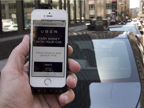 The ride-sharing app Uber is shown on a smartphone in Montreal on May 14, 2015.