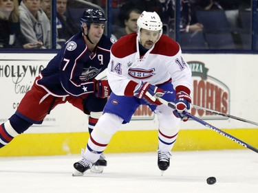 Montreal Canadiens' Tomas Plekanec, right,  works for the puck against Columbus Blue Jackets' Brandon Dubinsky during the first period of an NHL hockey game in Columbus, Ohio,  Monday, Jan. 25, 2016.