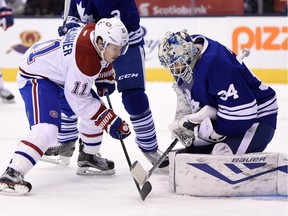 Toronto Maple Leafs goalie James Reimer makes a save as Montreal Canadiens' Brendan Gallagher (11) looks for a rebound during first period NHL action in Toronto on Saturday, Jan. 23, 2016.