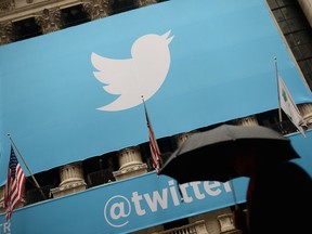 This Nov. 7, 2013, file photo shows the logo of Twitter on the front of the New York Stock Exchange in New York.