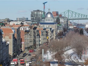A cityscape winter view of the Old Port of Montreal including de la Commune St. and the Jacques-Cartier Bridge seen from the Pointe-à-Callière Museum on Wednesday, Jan. 27, 2016. (Dario Ayala / Montreal Gazette)