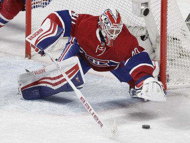 MONTREAL, QUE.: FEBRUARY 7, 2016 -- Goalie  Ben Scrivens of the Montreal Canadiens dives on a loose pucki in the first period of an N.H.L. game against the Carolina Hurricanes at the Bell Centre in Montreal Sunday, February 7, 2016. (John Kenney / MONTREAL GAZETTE)