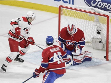 MONTREAL, QUE.: FEBRUARY 7, 2016 -- Jeff Skinner of the Carolina Hurricanes scores on goalie  Ben Scrivens of the Montreal Canadiens in the first period of an N.H.L. game at the Bell Centre in Montreal Sunday, February 7, 2016. (John Kenney / MONTREAL GAZETTE)