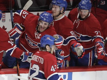 Sven Andrighetto of the Montreal Canadiens is congratulated by teammates, from the left, Max Pacioretty, Lars Eller and Alex Galchenyuk after his shoot-out winning goal against the Carolina Hurricanes at the Bell Centre on Sunday, Feb. 7, 2016. (John Kenney / MONTREAL GAZETTE)