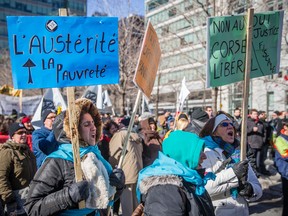 Protesters from the Coalition Main Rouge march In Montreal on Monday, February 22, 2016.