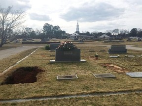 The Lee family cemetery plot is seen Saturday, Feb. 20, 2016, in Monroeville, Ala. Lee, the elusive author of best-seller &ampquot;To Kill a Mockingbird,&ampquot; died Friday, Feb. 19, according to her publisher Harper Collins. She was 89. A private funeral service was held for Lee on Saturday. (AP Photo/Kim Chandler)
