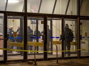 Montreal police and campus security at the scene where a work accident led to a man’s death at the Pavillon Roger-Gaudry of the University of Montreal in Montreal on Friday, February 19, 2016. The accident occurred as the man was working on an escalator.