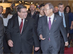United Nations Secretary General Ban Ki-moon, right, is greeted at city hall by Montreal mayor Denis Coderre Friday, February 12, 2016 in Montreal.