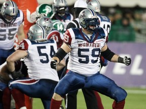 Montreal Alouettes' tackle Josh Bourke celebrates a tackle during first-quarter action of the 2010 Grey Cup final between the Montreal Alouettes and the Saskatchewan Roughriders at Commonwealth Stadium in Edmonton Nov. 28, 2010.