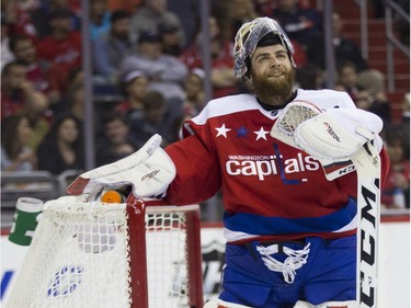 Washington Capitals goalie Braden Holtby looks off after giving up a goal to the Montreal Canadiens during the first period of an NHL hockey game, on Wednesday, Feb. 24, 2016, in Washington.
