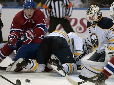 Montreal Canadiens' Brendan Gallagher (11) battles for the puck in front of Buffalo Sabres' Chad Johnson (31) during the second period of an NHL hockey game, Friday, Feb. 12, 2016, in Buffalo, N.Y.