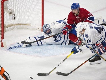 Montreal Canadiens' Brendan Gallagher (11) movestowards the puck as Toronto Maple Leafs goaltender Jonathan Bernier covers the net and Leafs' Morgan Rielly (44) defends during third period NHL hockey action in Montreal, Saturday, February 27, 2016.