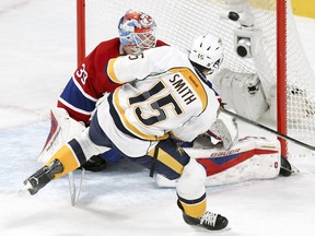 Nashville Predators' Craig Smith shoots the puck past Montreal Canadiens goalie Mike Condon for the winning shootout goal on Monday.