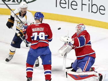Mike Condon makes a save as teammate Andrei Markov and Nashville Predators Mike Riberio watch rebound during action on Monday, Feb. 22, at the Bell Centre in Montreal.
