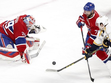 Mike Condon stops shot by Nashville Predatorss Filip Forsberg as Habss Andrie Markov defends during second-period action on Monday, Feb. 22, at the Bell Centre in Montreal.