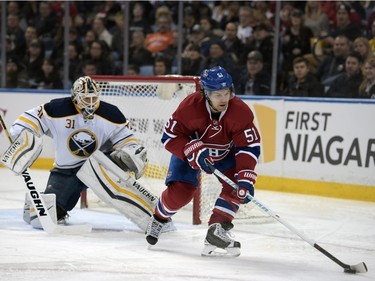 Buffalo Sabres goaltender Chad Johnson (31) watches Montreal Canadiens centre David Desharnais (51) who controls the puck during the second period of an NHL hockey game, Friday, Feb. 12, 2016, in Buffalo, N.Y. Buffalo won 6-4.