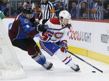 Colorado Avalanche defenceman Erik Johnson, left, tries to use his stick to slow down Montreal Canadiens right wing Sven Andrighetto, of Switzerland, in the third period of an NHL hockey game Wednesday, Feb. 17, 2016, in Denver. Colorado won 3-2.
