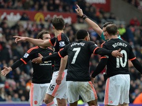Manchester United's Dutch midfielder Memphis Depay (3R) and teammates call for a handball after Depay struck a shot towards goal during the English Premier League football match between Sunderland and Manchester United at the Stadium of Light in Sunderland, northeast England on Feb. 13, 2016.  Sunderland won the match 2-1.
